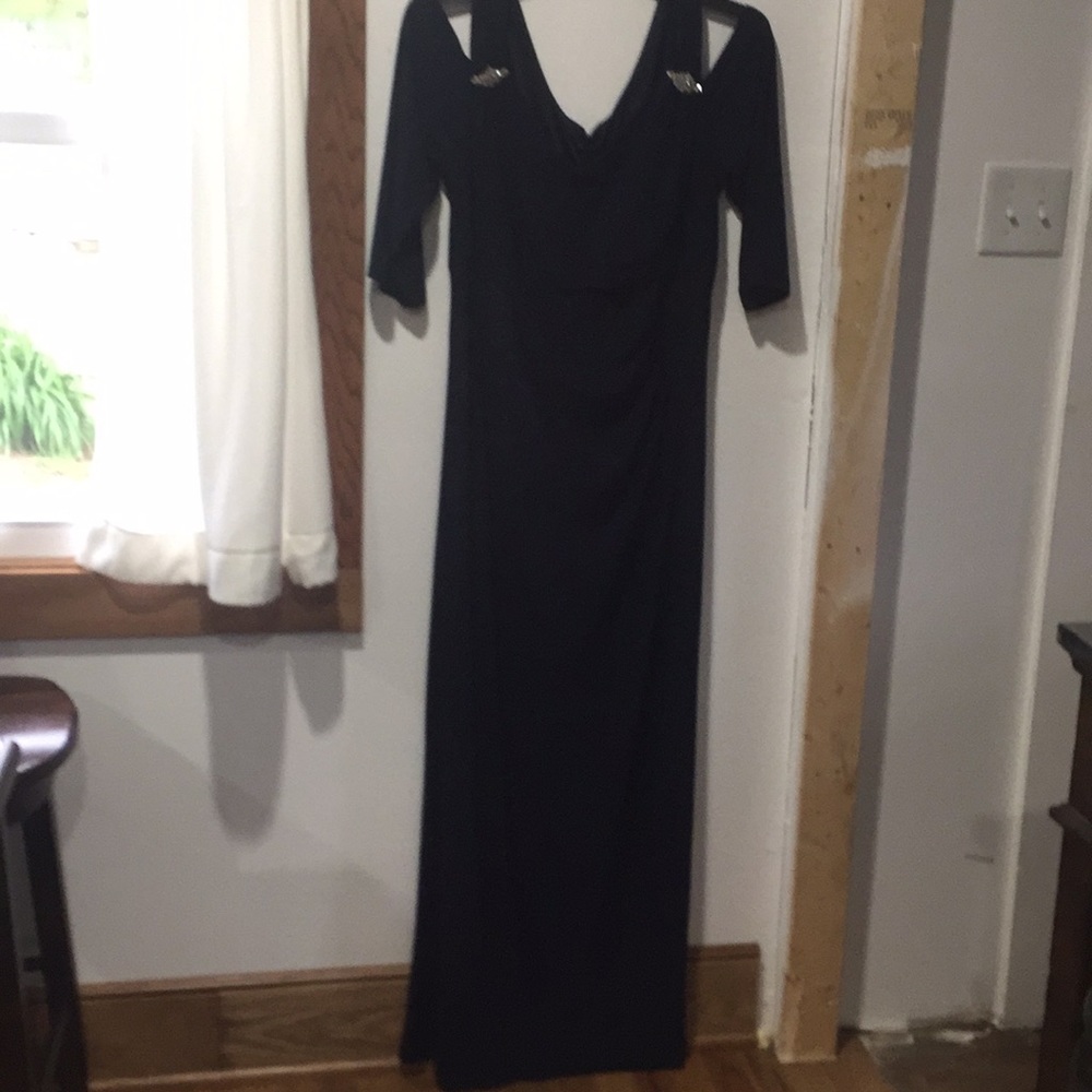Navy blue formal dress exposes shoulder
